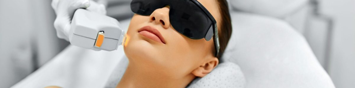 49277002 - skin care. young woman receiving facial beauty treatment, removing pigmentation at cosmetic clinic. intense pulsed light therapy. ipl. rejuvenation, photo facial therapy. anti-aging procedures.